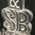 Initials ice sculpture vodka luge in Fulham