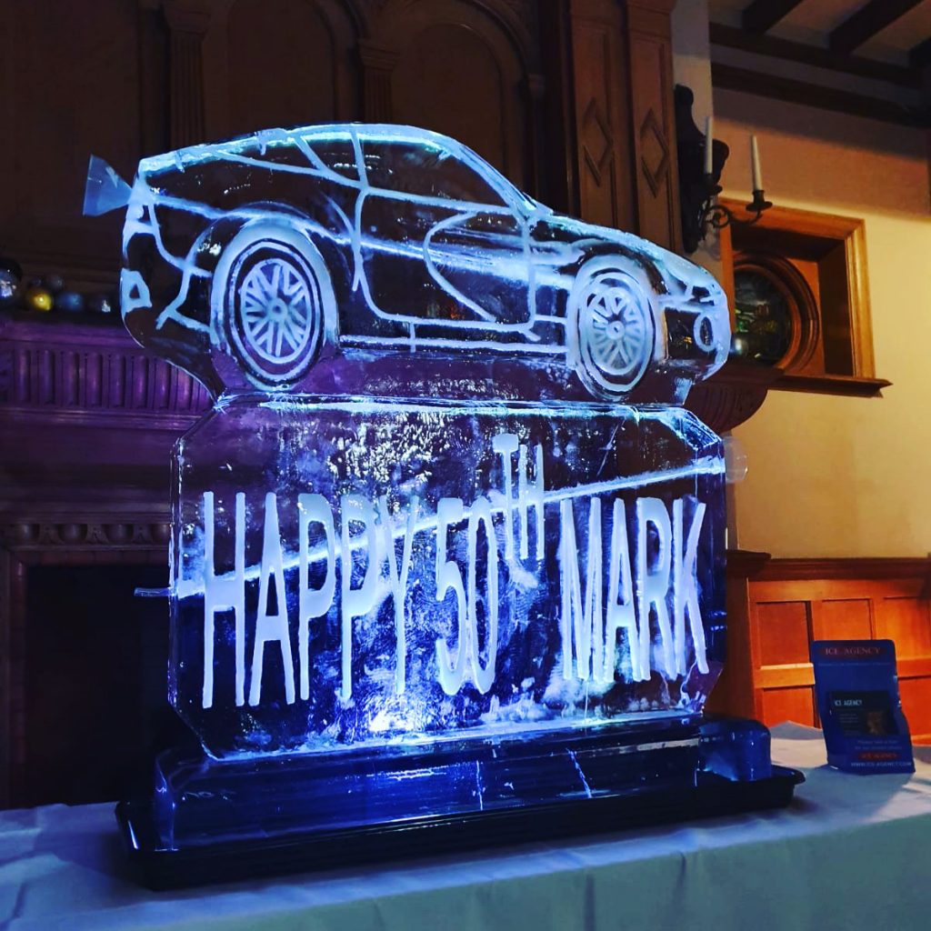 Car ice sculpture drinks luge for 50th birthday in Kensington