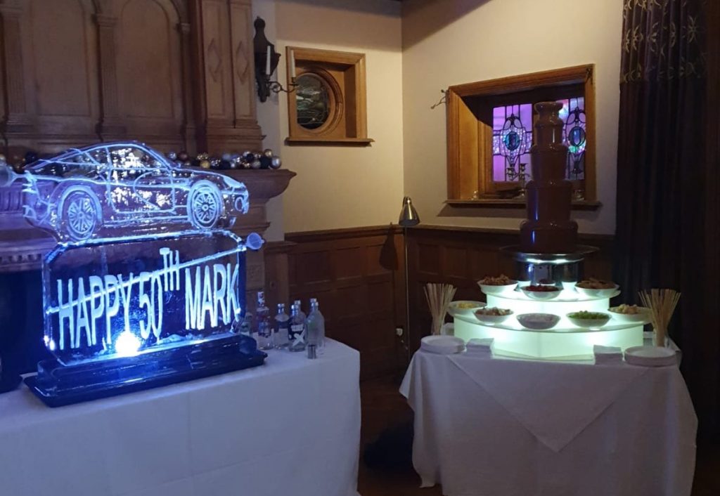 50th Birthday Ice Sculpture Vodka Ice Luge with large Chocolate Fountain