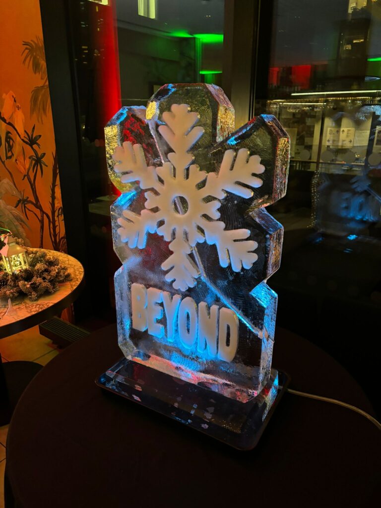 Snowflake ice sculpture vodka luge for Beyond Law Group at Gino D'Acampo Manchester