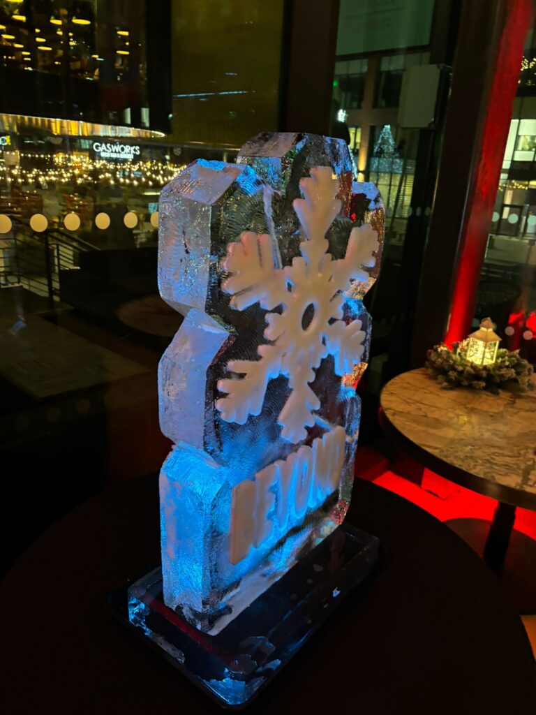 Snowflake ice sculpture vodka luge for Beyond Law Group at Gino D'Acampo Manchester