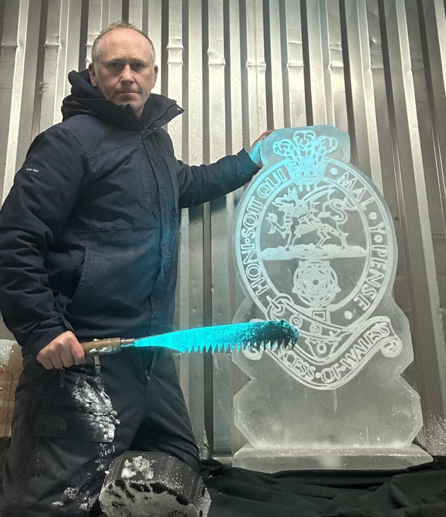 Princess of Wales' Royal Regiment Cap Badge ice sculpture vodka luge for dine out.